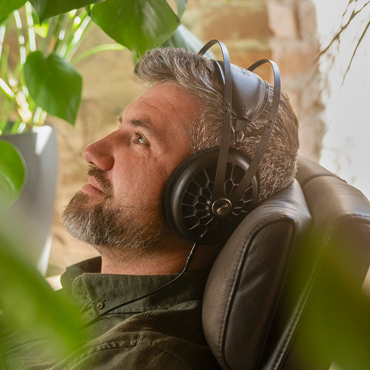 Man listening to Meze Audio premium headphones 105 AER dynamic driver open-back