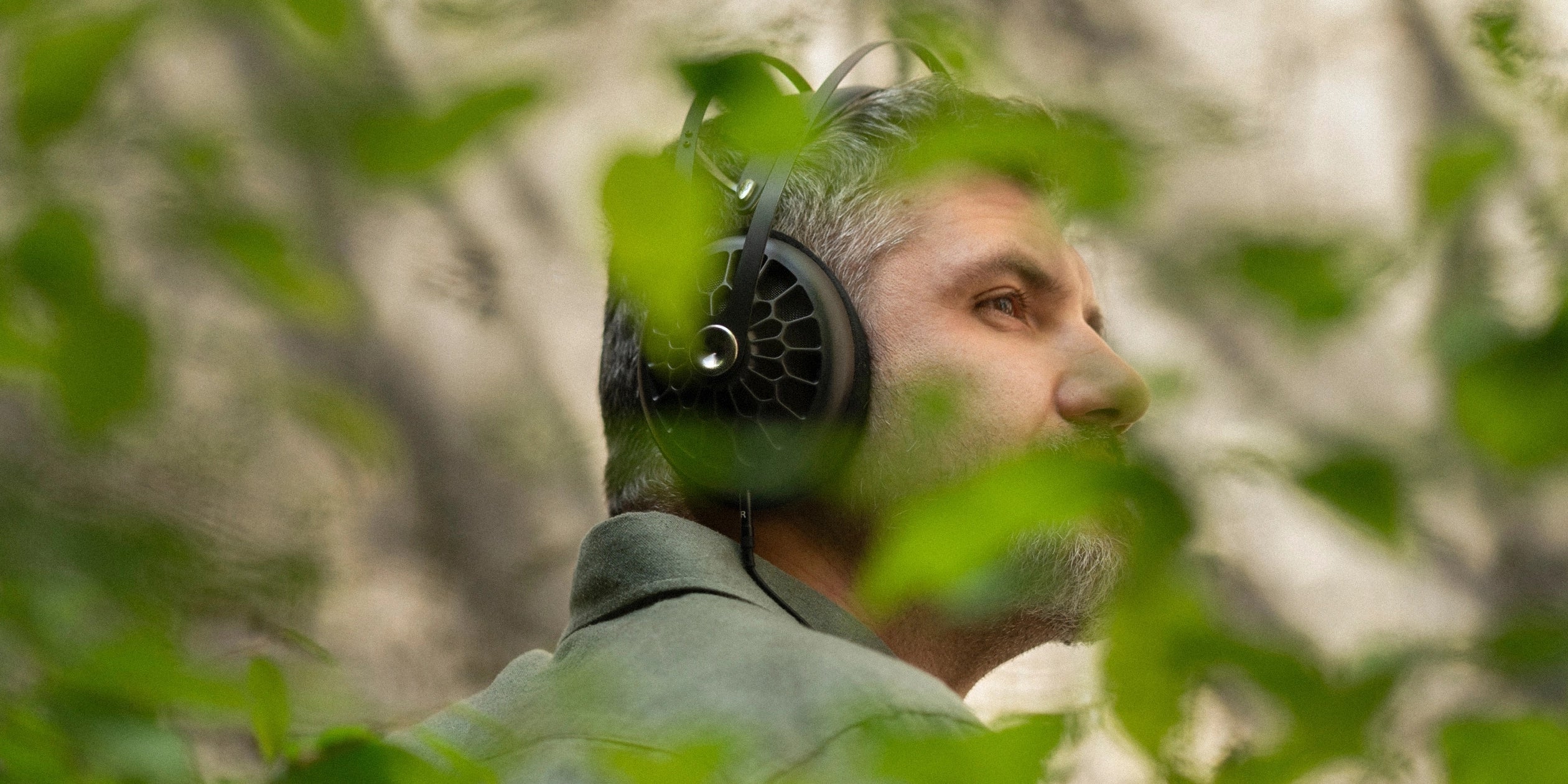 Man listening to Meze Audio 105 AER premium open-back headphones dynamic driver