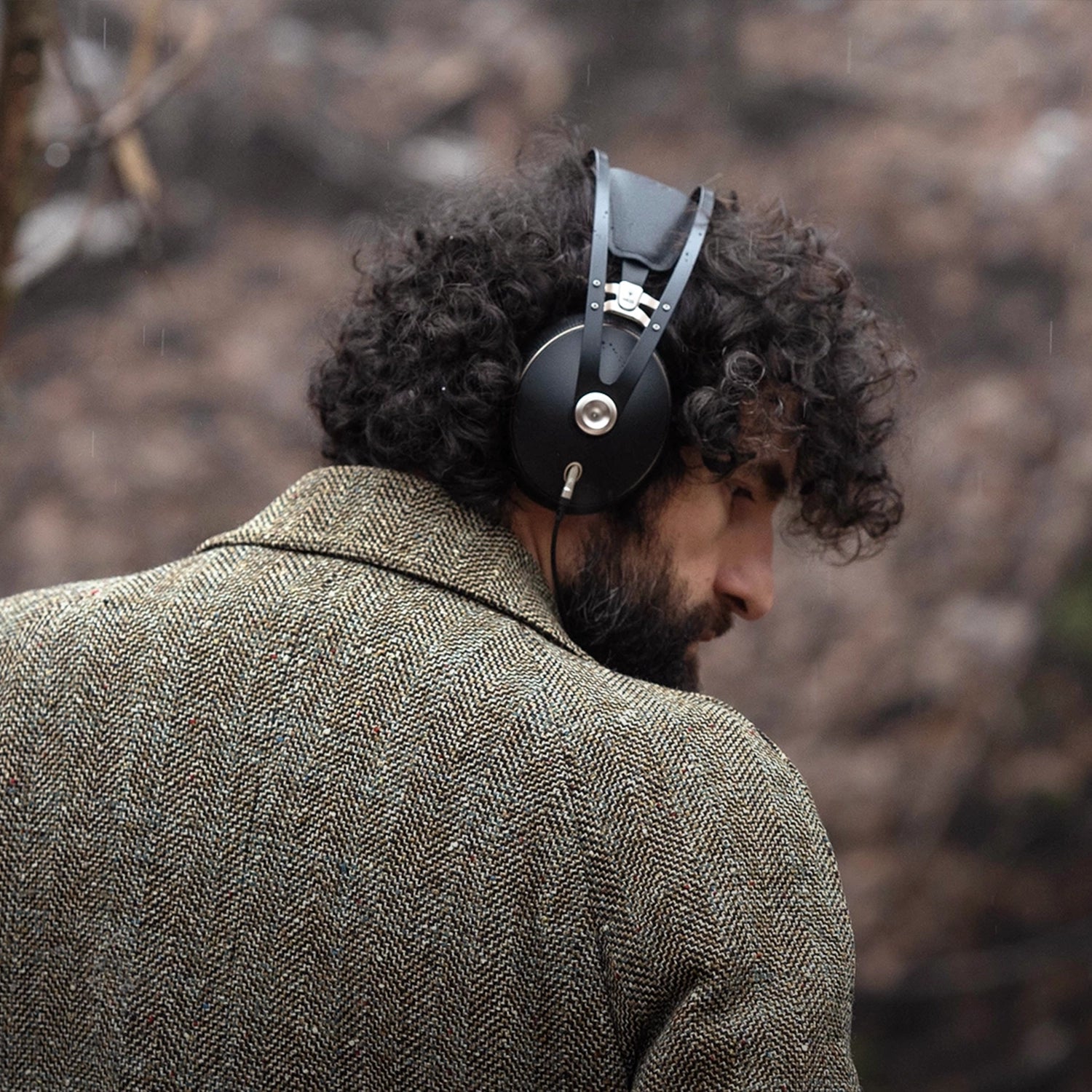 Meze Audio 99 NEO best open back hifi audiophile premium headphones worn by man walking in a forest