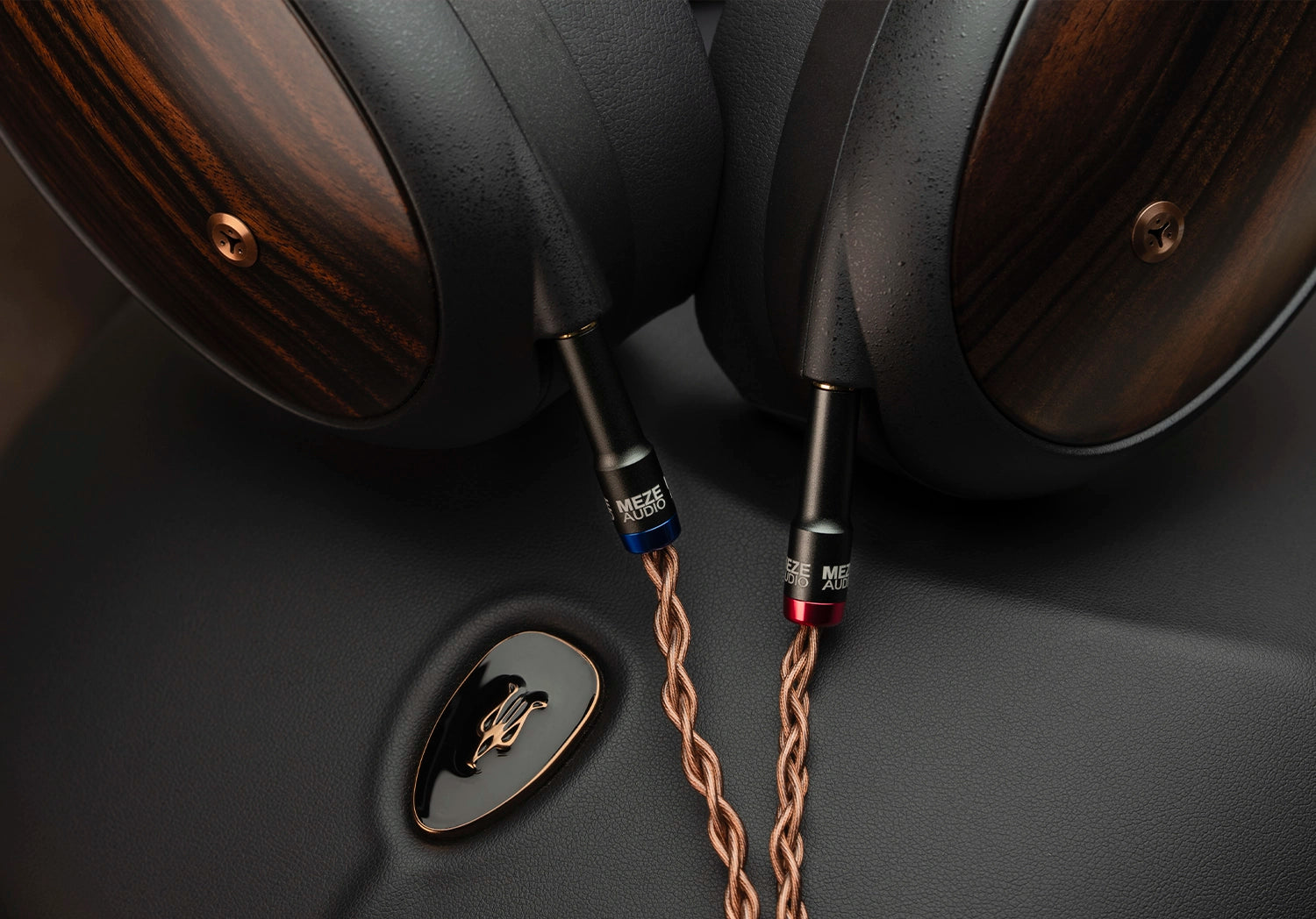 Meze Audio Liric Second Gen planar magnetic closed back headphones close-up cup view with balanced cable