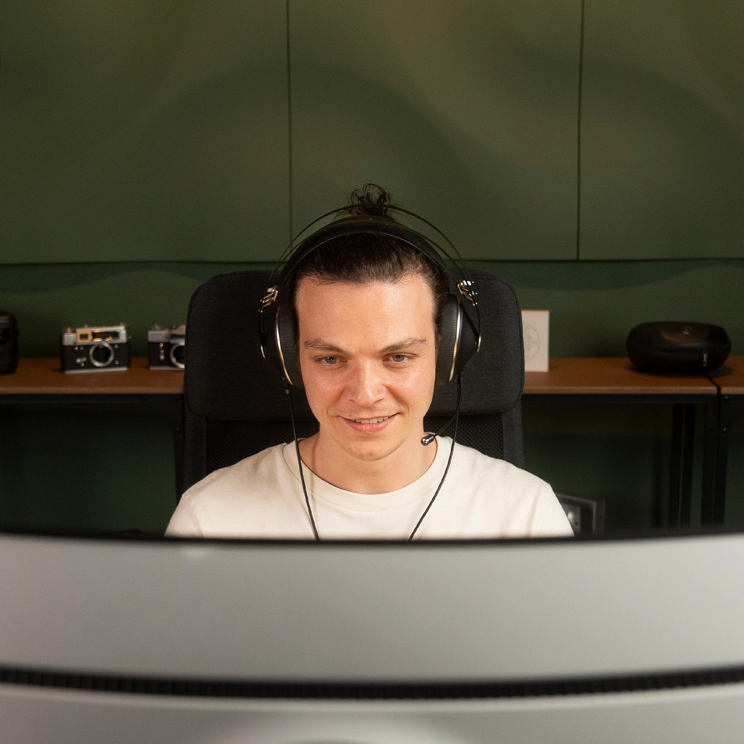 Player using the Meze Audio 99 NEO dynamic driver closed-back audiophile gaming headset during a PS5 car game