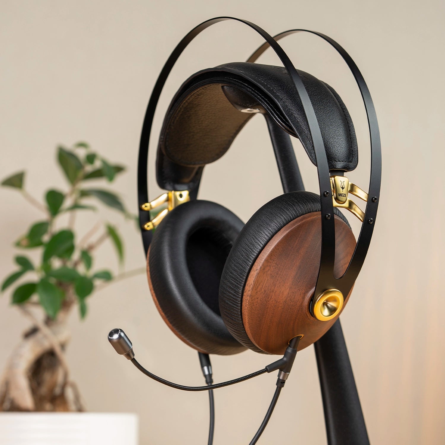 Meze Audio 99 Classics closed-back dynamic driver audiophile gaming headset resting on a wooden desk