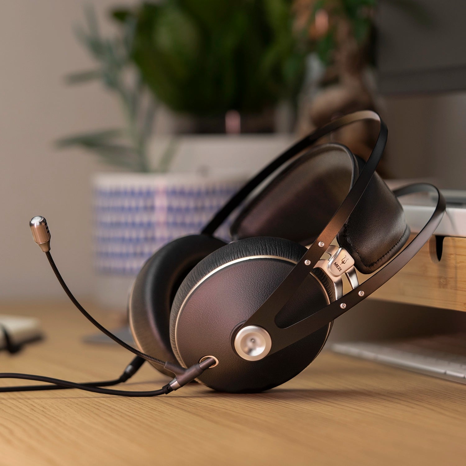 Meze Audio 99 NEO closed-back dynamic driver audiophile gaming PS headset resting on a desk