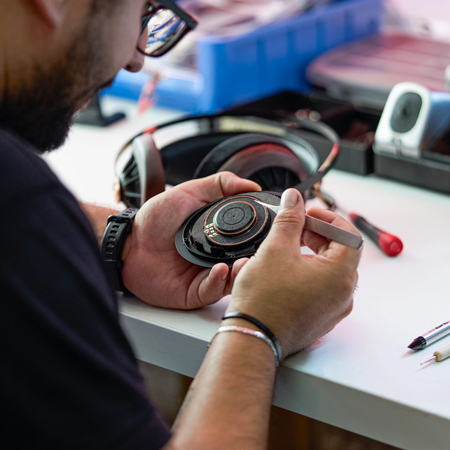 Audio engineer working on a 109 PRO open back audiophile headphones dynamic driver