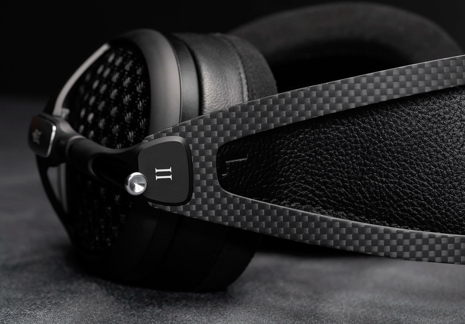 Meze Audio Empyrean II open back audiophile headphones cup and carbon fiber headband close-up